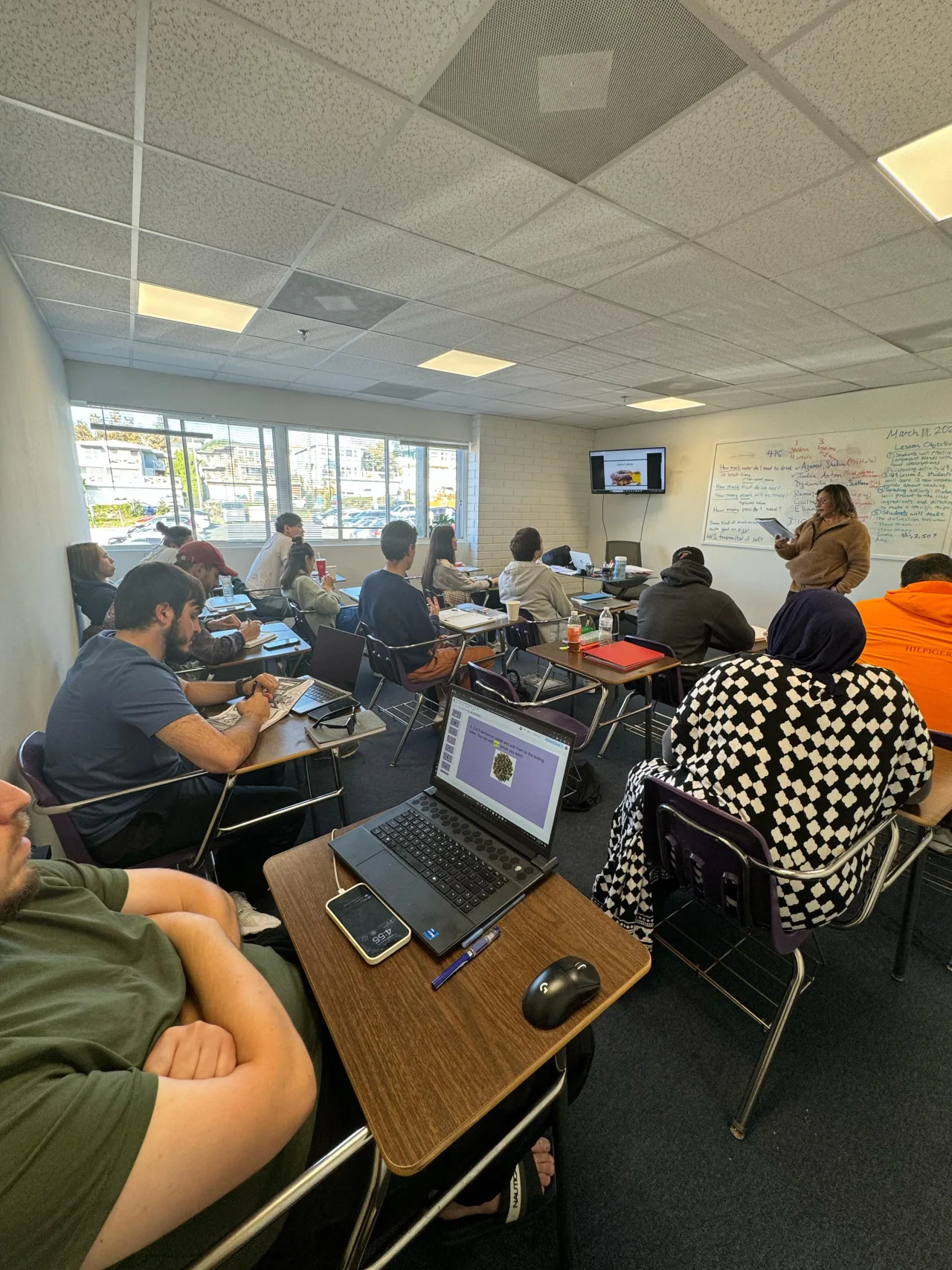Students learning English in a classroom at Internexus Los Angeles